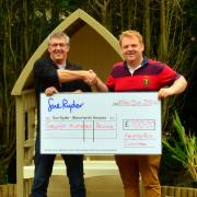 Keighley Gala chairman Andrew Jackson, left, presents a cheque to Manorlands fundraiser Andrew Wood