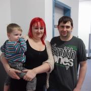 Former emergency department patient Gareth Scott, right, with his partner Phillipa Hall and their son Bobby Scott-Hall