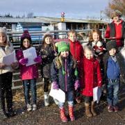 Lees schoolchildren sing carols at Denholme garden centre during Christmas celebrations