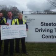 The Steeton Driving Test Centre team with its cheque for Manorlands, from left, manager Kerry Nicholson, Carwyn Huntley, Rob Lawler and Karen Place