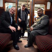 John Grogan MP and the Mayor of Keighley Councillor Mohammed Nazam seated with Keith Whitmore between themas they visit the Ingrow station exhibitions for the opening of National Heritage Days at the Keighley Worth Valley railway..