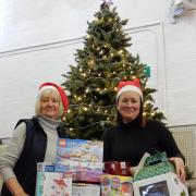 Keighley Salvation Army community development manager, Chris Bown, left, and community and family worker Helen Myers with some of the toys