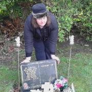 Andrea Walker at her daughter Ellie's grave.