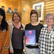 Retail manager Danielle Cadamarteri holds the Brontë Parsonage Museum’s Museums + Heritage Award, with, from left, retail assistant Laura Kerry, museum manager Nicola Peel and retail assistant Leigh Perryman.