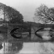 IT is hard to realise that this placid and beautiful image represents the forerunner of the present busy ferro-concrete bridge over the River Aire at Stockbridge.