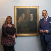 Arts Minister Michael Ellis with Brontë Parsonage Museum executive director Kitty Wright as they examine the Pillar Portrait. Picture by Simon Warner
