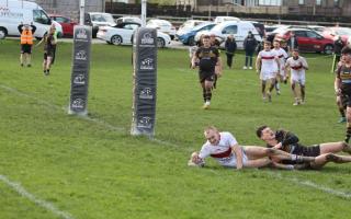 Adam Gaunt squeezes over to score the winning try for Keighley.