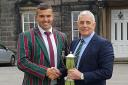 From left, former student, Leicester Tigers ace James Whitcombe, is presented with Woodhouse Grove School's Burnhill Cup by Steve Burnhill