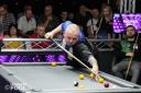 Chris Melling attempting a shot against long-time rival and friend Mick Hill in a game earlier this year. Picture: Ultimate Pool.