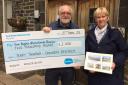 Terry Thompson, and his wife Alison, present a cheque to Manorlands