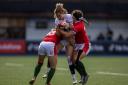 England's Ellie Kildunne is tackled by Wales Hannah Jones (left) and Robyn Wilkins during the third round of the TikTok Women's Six Nations in November. Credit: PA photo