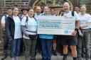 The Big Walk for Mum team hands over a cheque to Manorlands