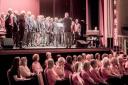 Steeton and Airedale male voice choirs on stage, and Ilkley Moornotes seated, at the concert