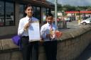 Inara Rahman and Aman Iqbal outside McDonald's restaurant in Keighley, with their letter and some litter examples