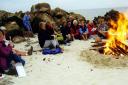 Former members of the 4th Keighley Guides enjoy a campfire on Tiree, in the Hebrides, during the 2010 reunion