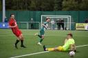 Jake Townsend (green) slots home Steeton's first goal in the win over South Liverpool.