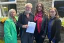 Pictured with the petition are, from left, Councillor Lisa Robinson, Morton Village Society chair David Flaherty, resident Victoria Holdgate and Councillor Caroline Firth