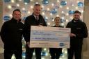 At the cheque handover are, from left, junior funeral director Paul Wilkinson, managing director David Gallagher, Manorlands’ Liv Moffat and junior funeral director Sam Gallagher