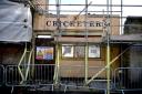 The former Cricketers Arms pub undergoes demolition