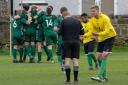 Steeton celebrate as a Golcar player protests to the referee in the former side's 3-2 win. Picture: John Chapman
