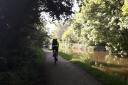 A cyclist is pictured by Amy Clough making his way along the Leeds and Liverpool Canal towpath