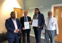 Saby – second from right – receives his award from MP Robbie Moore, with Cllr Mohammed Nazam, far left, and Saby's father Mohammed Ali