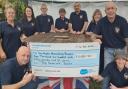 Staff and regulars at the Reservoir Tavern with their cheque for Manorlands