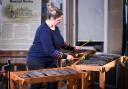 Percussionist Polly McMillan plays the musical stones