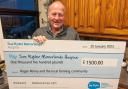 Roger Penny with the cheque for Manorlands