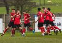 Silsden's top goalscorer Luke Brooksbank (second left) is mobbed after scoring what turned out to be the winner in their derby against Thackley on Saturday. Picture: Martin Taylor.