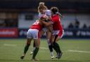 England's Ellie Kildunne is tackled by Wales Hannah Jones (left) and Robyn Wilkins during the third round of the TikTok Women's Six Nations in November. Credit: PA photo