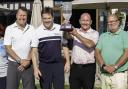 The winning team from the golf day, with its trophy