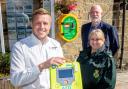Chris Chadwick, left, of Airedale Group, with community first responder Malcolm Linford and Joanne Watson, from Yorkshire Ambulance Service
