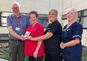 John Lofthouse presents the prize to, from left, Chrisseen Platt, discharge co-ordinator Adele Wattam and ward manager Sophie Crabtree