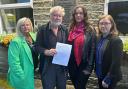 Pictured with the petition are, from left, Councillor Lisa Robinson, Morton Village Society chair David Flaherty, resident Victoria Holdgate and Councillor Caroline Firth