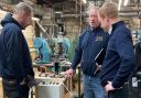 MP Robbie Moore, right, during his visit to George Emmott (Pawsons) Ltd