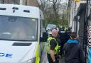 Police carry out a raid as part of the operation