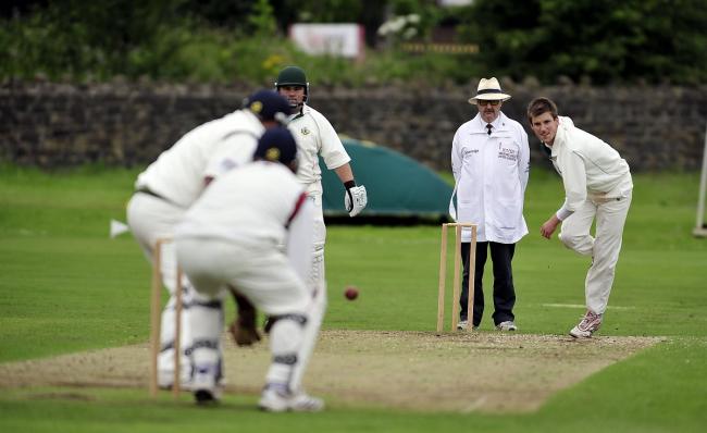 A Bradford League umpire stands in a match between Keighley and Idle a few years ago. Picture: Andy Garbutt.