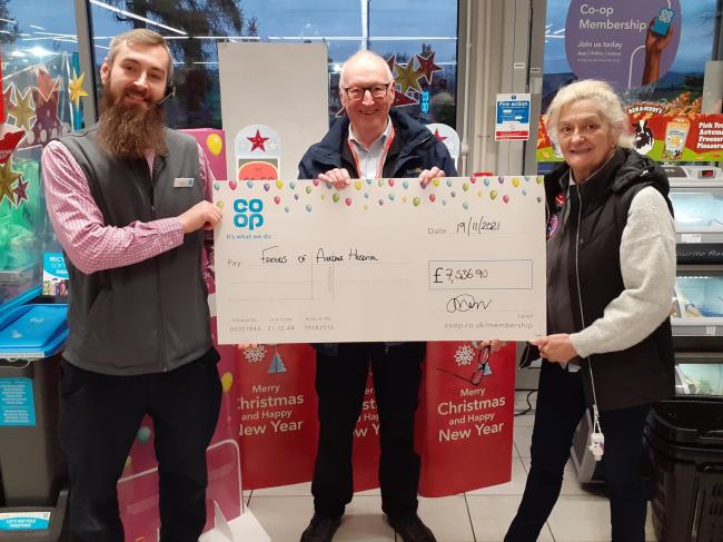 Friends chair John Lofthouse receives a cheque from Jamie Carr, manager of Steeton Co-op, and Anne Marie Vear from the Co-op's Cross Hills filling station shop