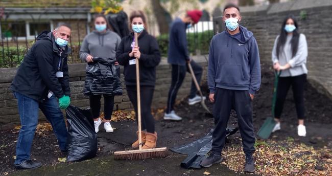 Volunteers help clear the car park (photo: Maximus UK)