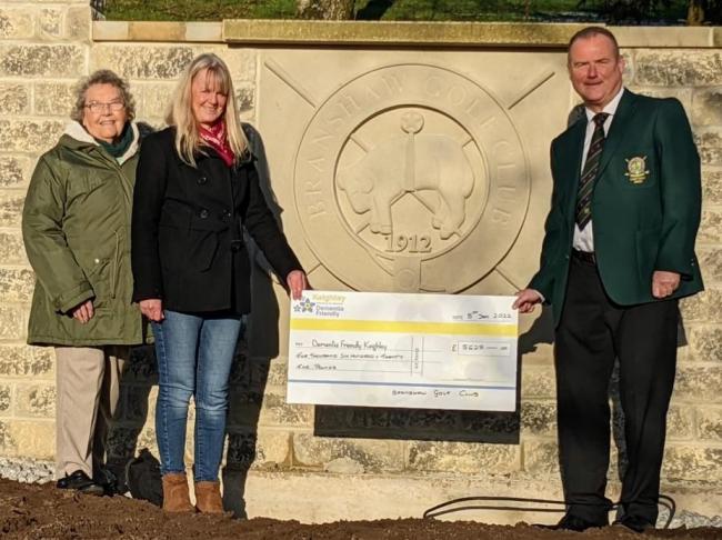Helen Charters and Barbara Wood, of Dementia Friendly Keighley, receive a cheque from Branshaw Golf Club's Darren O’Driscoll