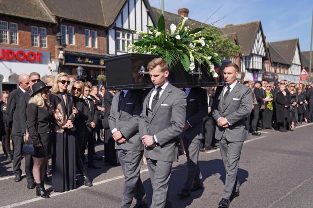 Keighley News: The coffin of The Wanted star Tom Parker is carried ahead of his funeral. (PA)