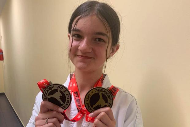 Yvie Ling Hegarty with her medals that she won in Poland.