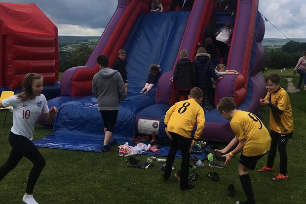 Enjoying the bouncy castle at a previous club fun day