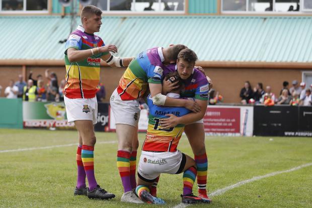Cougars celebrate a Jack Miller try in their 2019 Pride game against West Wales. Picture: Charlie Perry.