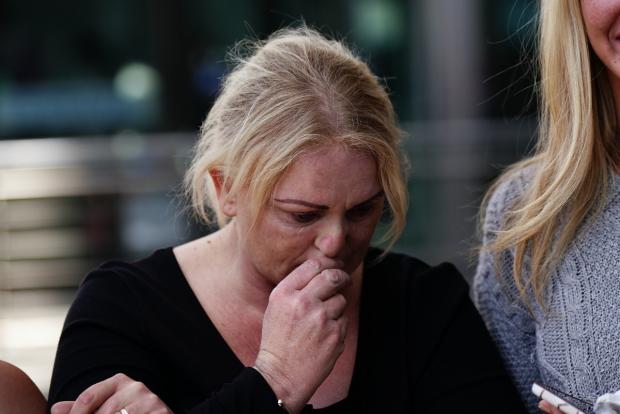 Keighley News: Archie's mother Hollie Dance surrounded by family and friends, outside the Royal London hospital in Whitechapel, east London, speaking to media following the death of her 12 year old son Archie Battersbee. (Aaron Chown/PA wire/PA images)