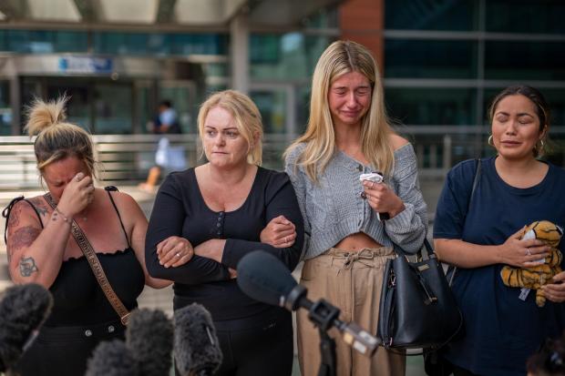 Keighley News: Hollie Dance (second left) surrounded by family and friends, outside the Royal London hospital in Whitechapel, east London