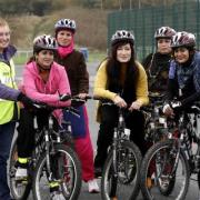 Cycling instructor Judy Connor, left, joins members of the Fit Women Cycling scheme, at Marley, Keighley