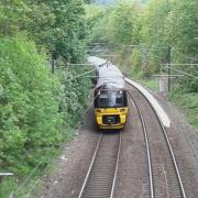 A Northern train leaves Keighley