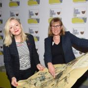 West Yorkshire mayor Tracy Brabin and Helen Noble, of Pennine Prospects, with a map of the region